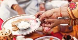 cople performing ayush havan with priest
